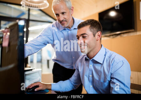 Business people working on computer Stock Photo