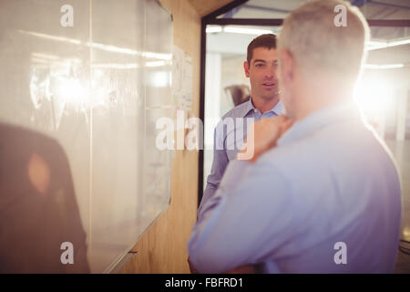 Businessmen discussing during a meeting Stock Photo
