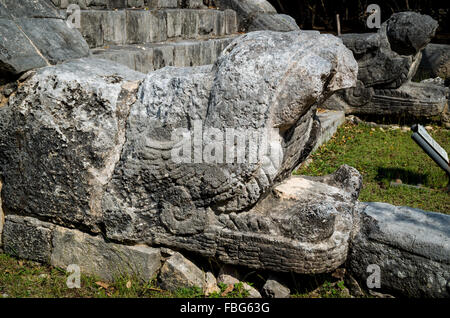 Carved Mayan statue of a Jaguar head on the Chichen Itza site in Yucatan, Mexico- A UNESCO world heritage site. Stock Photo