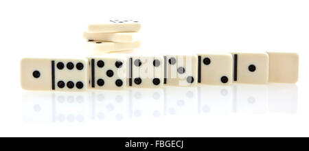 Row of white dominoes isolated on white background Stock Photo