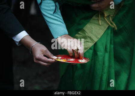 Kathmandu, Nepal. 16th Jan, 2016. President Bidhya Devi Bhandari (face unseen) offering prayers as part of initiation of the reconstruction campaign in Rani Pokhari, Kathmandu, Nepal on Saturday, Jan 16, 2016. Rani Pokhari is an historic pond built by King Pratap Malla in 1667 which is located in the heart of the city. Around nine months after the April 25 earthquake that hit Nepal, killing nearly 9,000 people and injuring hundreds others, National Reconstruction Authority sets to start post-quake reconstruction work. The International community has pledged an assistance of Rs. 4.1 billion. ( Stock Photo