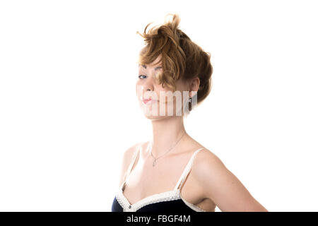 Studio Shot Of A Beautiful Young Woman With Messy Hair Posing Against A  Blue Background Stock Photo - Download Image Now - iStock