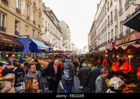 Aligre outdoor food market, busy fruit and vegetables outdoor market at the square of Aligre and street, rue Aligre. Paris, France. Stock Photo