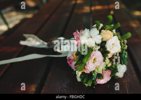 Wedding bouquet on a bench Stock Photo