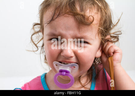 Toddler girl aged 2.5 years throwing a tantrum. Stock Photo