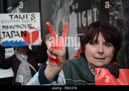 London, UK. 16th Jan, 2016. Protester holds a pease gesture as she marches down Oxford Street. She has red paint on her hands to symbolise blood. Credit:  Marc Ward/ Alamy Live News Stock Photo