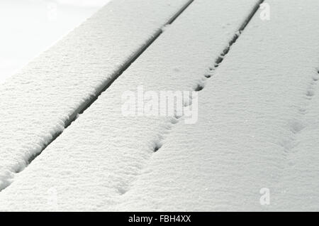 closeup to empty table covered with snow Stock Photo