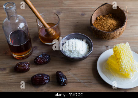 Selection of sweetener ingredients including honey sugar and maple syrup Stock Photo