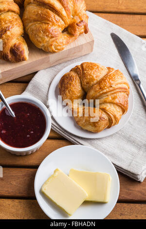 Croissants with butter and jam Stock Photo