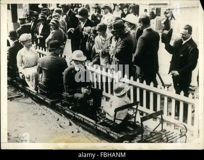 1915 - King George taken a ride in the Children's railway inthe Wembley Exhibition. Queen Mary, further back, seems to enjoy it, though the King has a somewhat ''this is a bit Unnecessary'' look on his face. © Keystone Pictures USA/ZUMAPRESS.com/Alamy Live News Stock Photo
