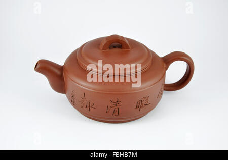 Clay brown teapot for tea on a white background Stock Photo