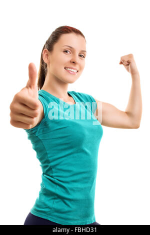 Willpower and strength to be fit. Smiling young athlete giving thumbs up, isolated on white background. Stock Photo