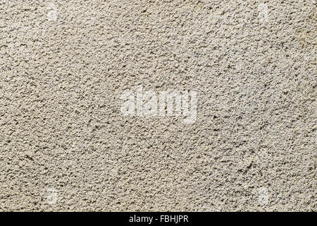 Texture of a wall from the made foam plaster. Types of external coverings of the building. Stock Photo