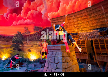 A diorama in Taman Mini Indonesia Indah showing people in traditional stone jump ceremony in Nias Island. Stock Photo