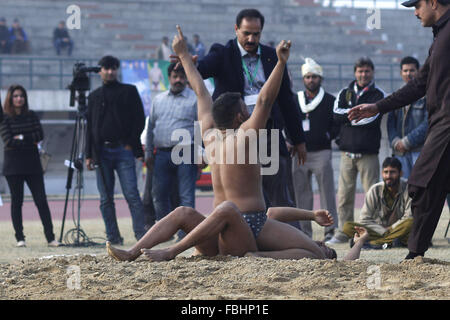 Lahore, Pakistan. 16th Jan, 2016. The wrestler defeats his opponent during RUSTAM-E-ZAMAN GAMA PEHALWAN DANGAL. Pakistani traditional wrestlers (Pehalwans) compete during RUSTAM-E-ZAMAN GAMA PEHALWAN DANGAL. © Rana Sajid Hussain/Alamy Live News Stock Photo