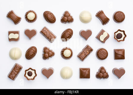 Dark, milk and white chocolates on a white background. Stock Photo
