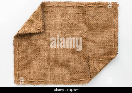 Frame of burlap with curled edges, lies on a white background, can be used as texture Stock Photo