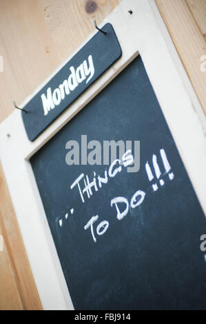 Blackboard with hook and weekday Stock Photo
