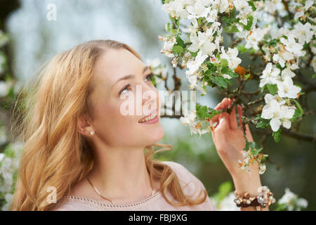 Young woman, portrait, blossoms, spring, view to the side Stock Photo