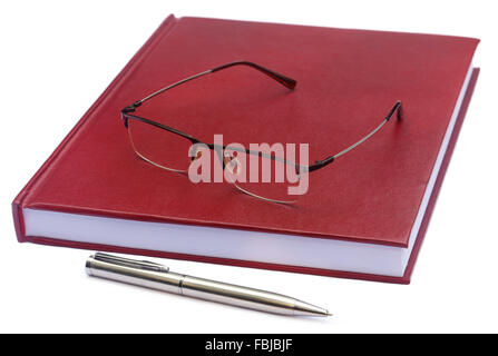Maroon colored thesis paper with spectacles over white background Stock Photo