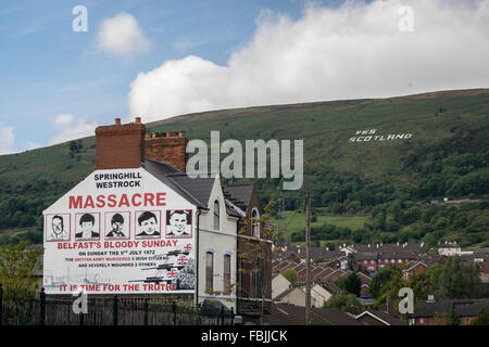 Springhill Westrock Massacre mural with Yes Scotland writing on Black Mountain overlooking Belfast City. Stock Photo