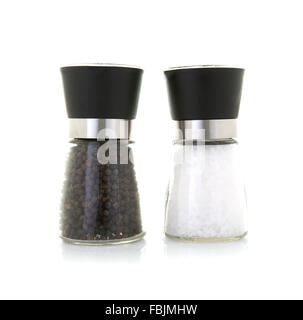 Glass salt and pepper grinders on a white background Stock Photo