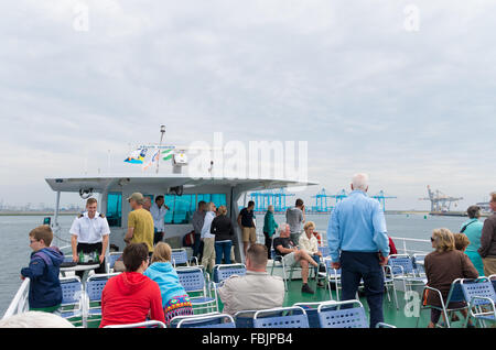 ROTTERDAM, NETHERLANDS - JUNE 28, 2015: Unknown people enjoying an organized tour in the rotterdam harbor, the largest one of Eu