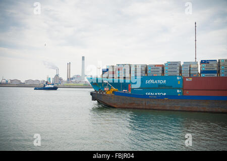 ROTTERDAM, NETHERLANDS - JUNE 28, 2015: Maersk Line container ship leaving the Rotterdam harbor. It is the world's largest conta
