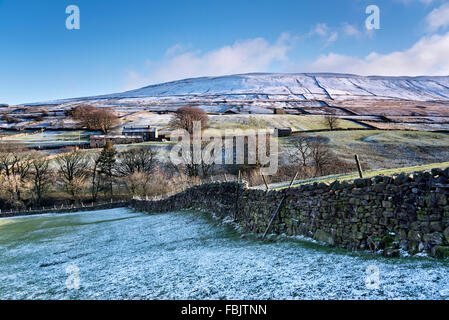 The Yorkshire Dales National Park near Hawes, with a snow-covered Wether Fell in the background, North Yorkshire, UK Stock Photo