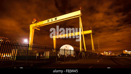 A night time photograph of the huge Harland and Wolff cranes in the Belfast shipyard where Titanic ship was built. Stock Photo