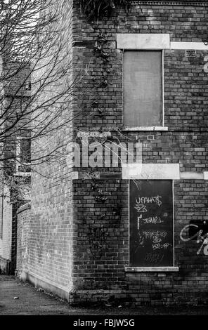 A gable end abandoned brick house in South Belfast's Holylands area. Stock Photo