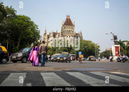 MUMBAI, INDIA - OCTOBER 9, 2015: Unidentified people by the Oriental buildings in Mumbai, India. Building  was built at 18850 an Stock Photo