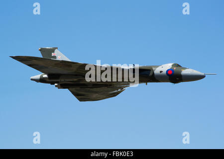 Avro Vulcan bomber XH558 Spirit of Great Britain in final year of flying at RIAT 2015 air show against bright blue sky Stock Photo