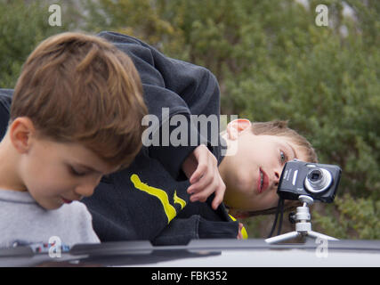 Lompoc, USA. 17th Jan, 2016. Children prepare to take photos of the launch of Falcon 9 rocket near Vandenberg Air Force Base in California, the United States, on Jan. 17, 2016. U.S. private spacecraft company SpaceX launched on Sunday morning the Jason-3 ocean-measuring satellite, but failed in its attempt to land the spent first stage of its Falcon 9 rocket on a ship in the Ocean. Credit:  Yang Lei/Xinhua/Alamy Live News Stock Photo