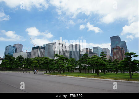 The view of the skyscrapers in Tokyo city during afternoon with the blue sky and white clouds Stock Photo