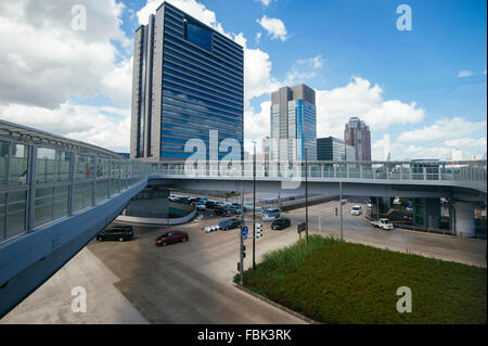 The view of the commercial buildings in Odaiba area of Tokyo, Japan during mid afternoon with the blue sky and white clouds Stock Photo