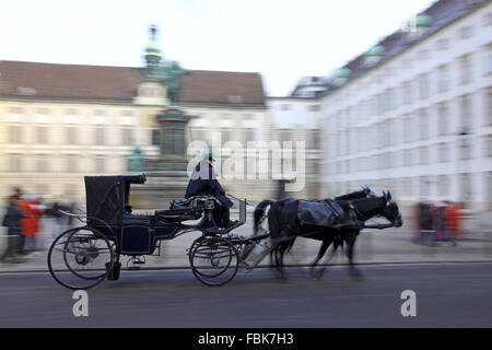 Horse-driven carriage at Hofburg palace, Vienna, Austria Stock Photo