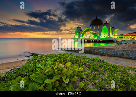 The view of Masjid Selat, Melaka during sunset. Masjid Selat (Strait Mosque) is one of the tourist attractions in Melaka. Stock Photo