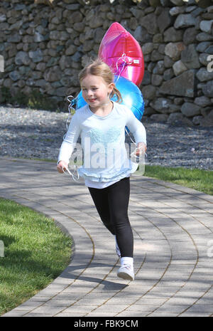 Young girl playing with balloons at a nursery Stock Photo