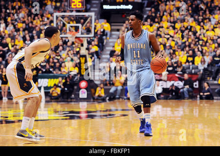 Wichita, Kansas, USA. 17th Jan, 2016. Indiana State Sycamores guard Devonte Brown (11) brings the ball up court as Wichita State Shockers guard Evan Wessel (3) defends during the NCAA Basketball game between the Indiana State Sycamores and the Wichita State Shockers at Charles Koch Arena in Wichita, Kansas. Kendall Shaw/CSM/Alamy Live News Stock Photo