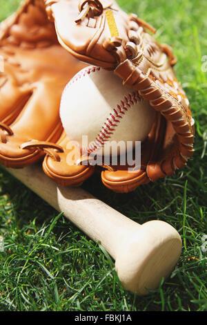 Baseball equipment on grass Stock Photo