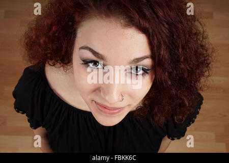 wide high angle view of beautiful young woman looking up Stock Photo