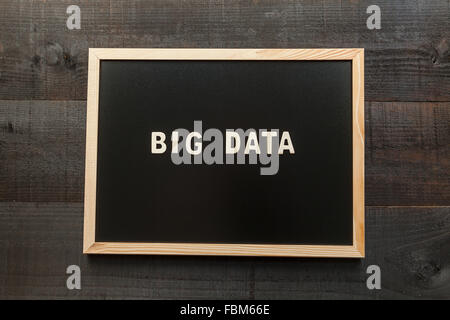 Wooden letters on slate and wood background with a concept message about the big data Stock Photo