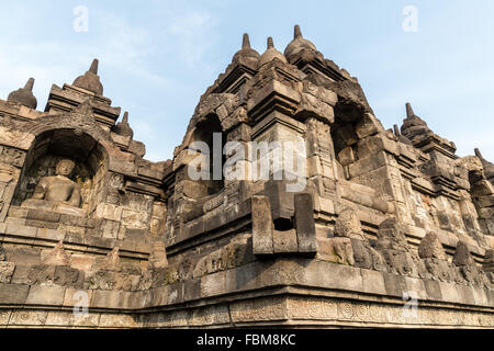 Stone Buddha sculpture. Borobudur. Indonesia. Borobudur is the largest Buddhist temple in the world. Stock Photo