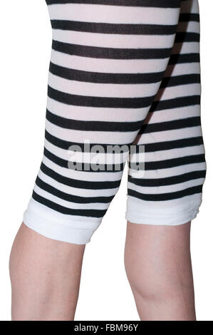 Preteen girl wearing striped knee socks, lifting 