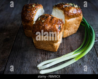 Bread rolls with spring onions Stock Photo