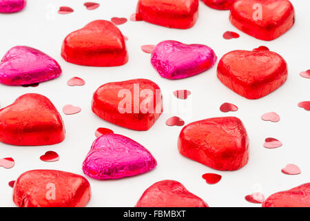 Heart shaped, Valentine's Day chocolates on an isolated white background. Stock Photo