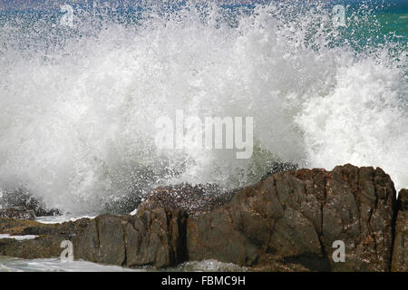Waves crashing onto rocks at Bloubergstrand, Cape Town, Western Cape Province, South Africa. Stock Photo