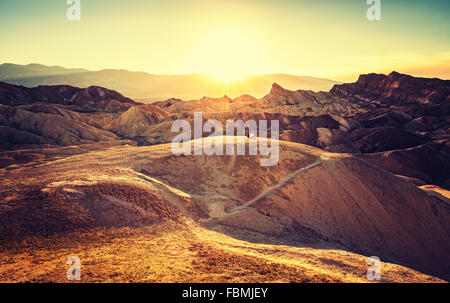 Retro toned sunset over Zabriskie Point, Death Valley National Park, USA. Stock Photo