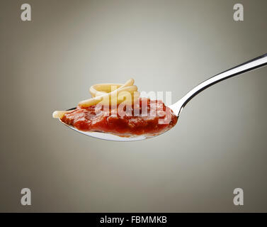 Spaghetti and bolognese sauce on a spoon Stock Photo